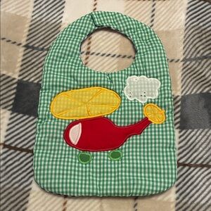 Vintage Green Checkered Baby Bib with Red Helicopter Design